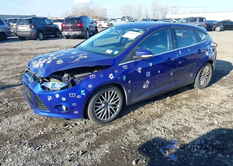 2013 Ford Focus Titanium z USA, uszkodzony, nr VIN 1FADP3N22DL128971